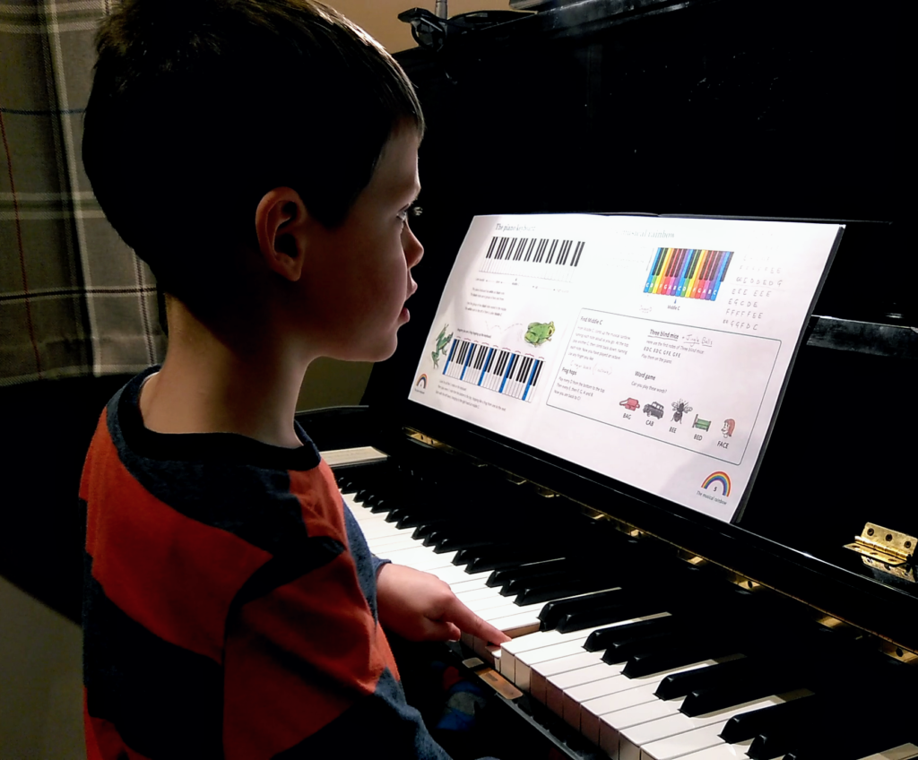 5 year old child playing piano