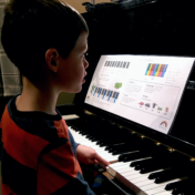 5 year old child playing piano